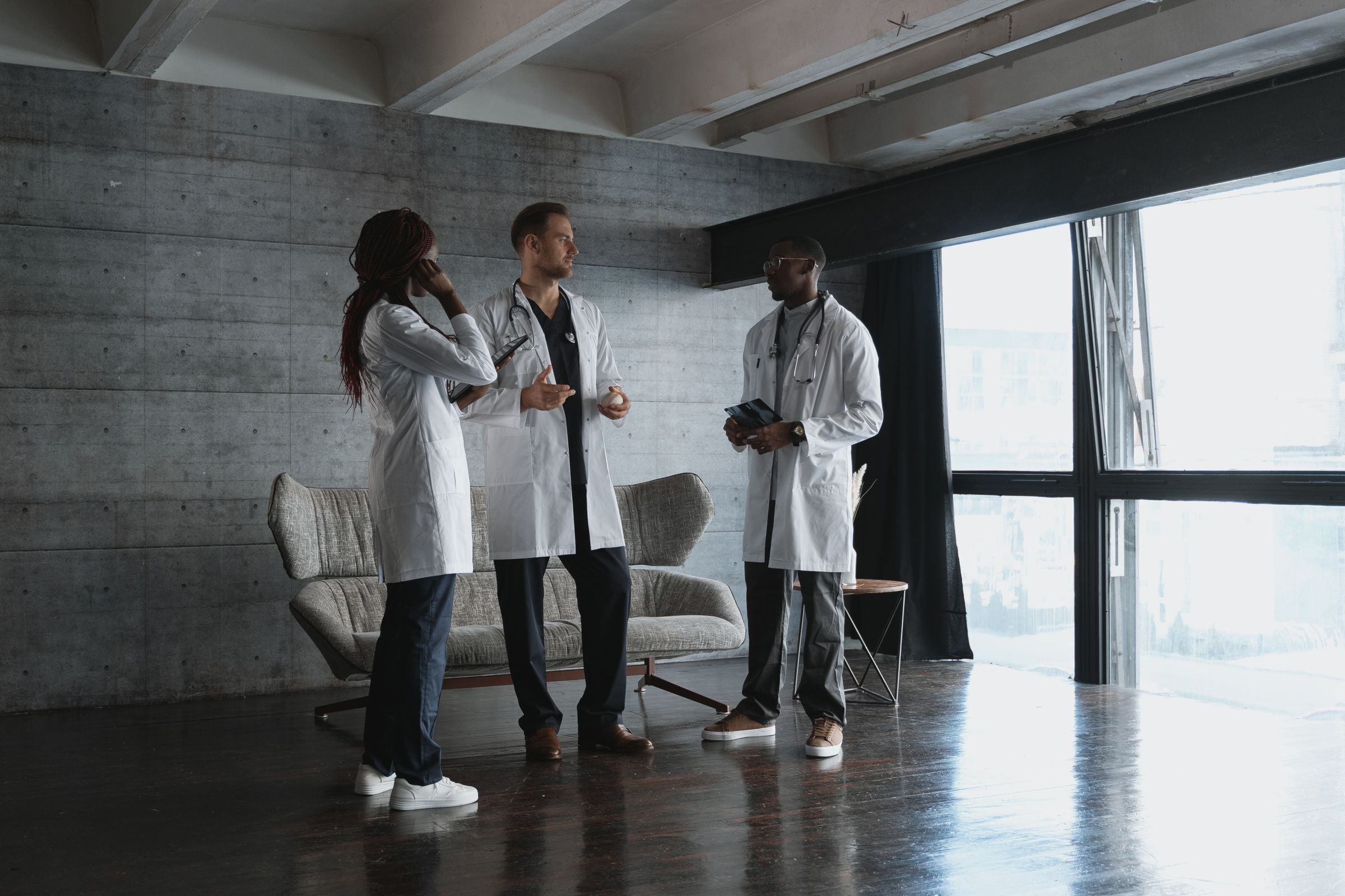 Three clinicians talking together