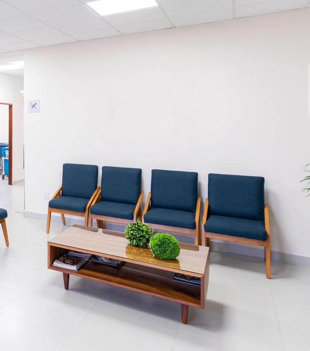 An empty practice waiting room with a row of chairs before opening